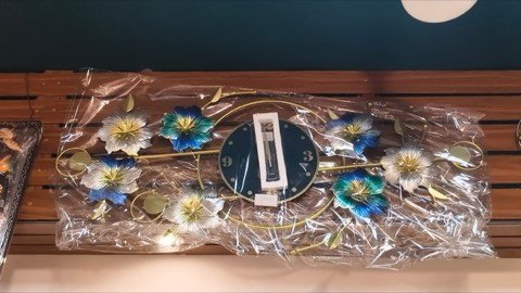 Floral-design wall clock with leaf accents