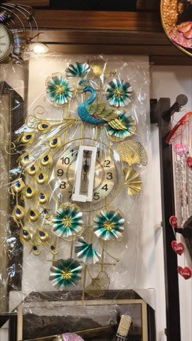 Handcrafted peacock-design pendulum wall clock