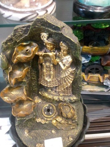 Radha Krishna rock-finish tabletop fountain showpiece